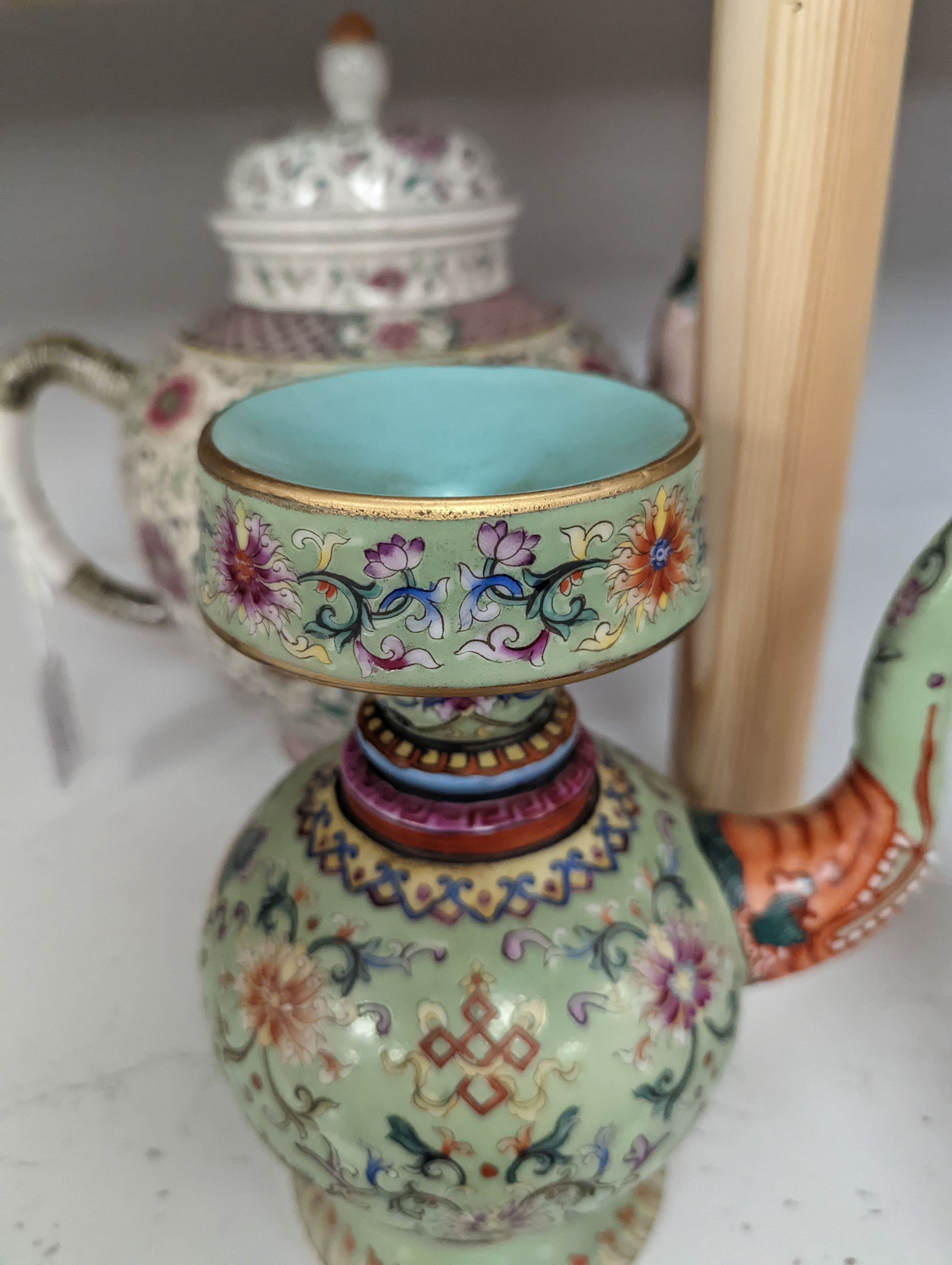 A large 19th century Chinese famille rose wine pot, and another wine pot, tallest 27cm